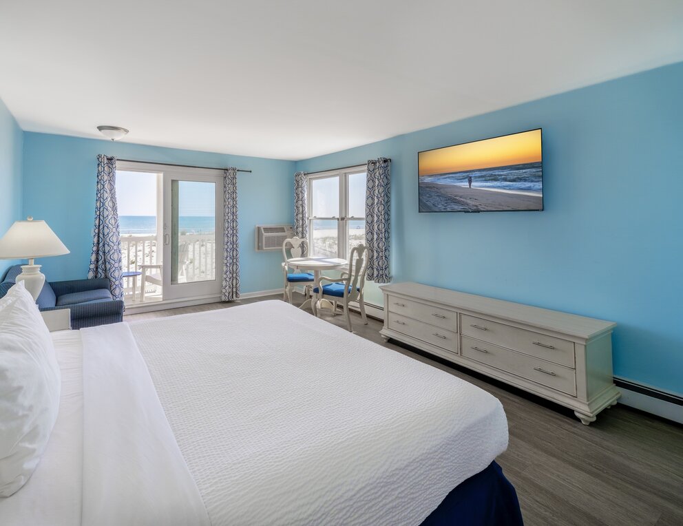 a bedroom with a bed and a television