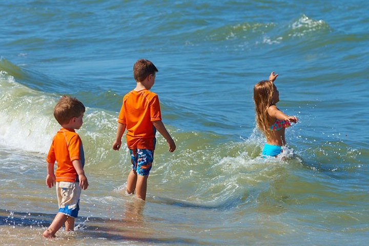 Children playing in the waves along Ship Bottom beach | Drifting Sands LBI